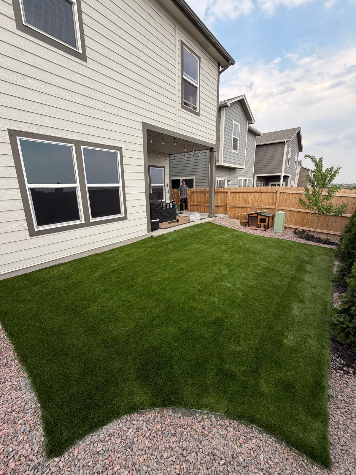 After: the same backyard with artificial turf installed by Peak Turf Solutions