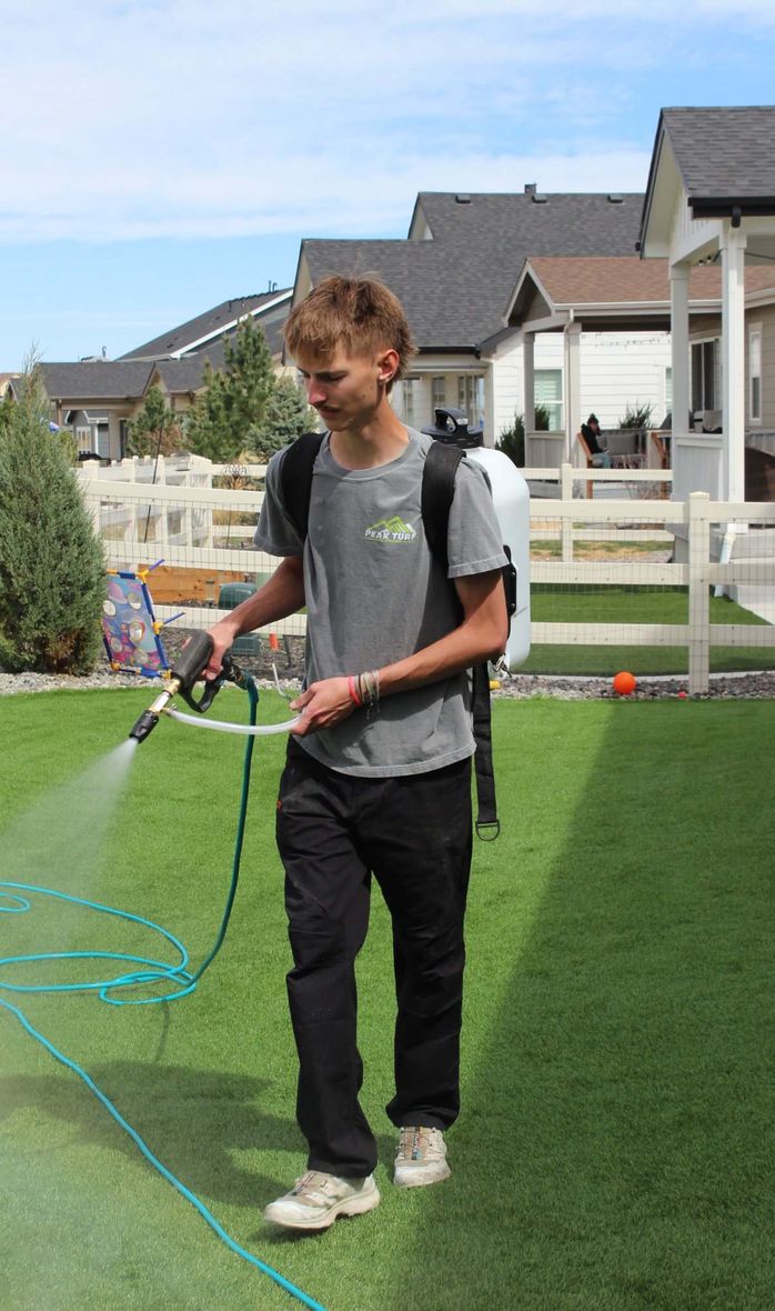 brush sweeping artifical turf in Colorado Springs, CO